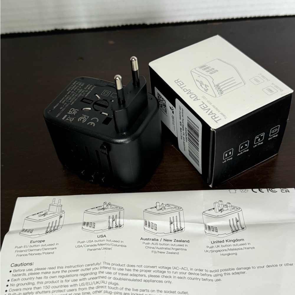 Universal Travel Adapter w/ USB Ports
- International Plug Converter EU UK
AU US
